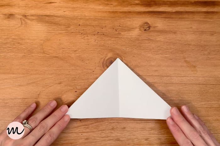 how to make a paper snowflake step 4 fold in smaller triangle for guide