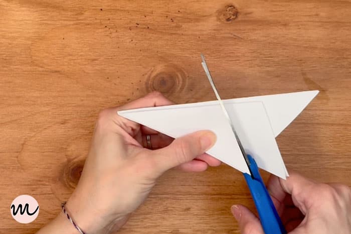 how to make a paper snowflake step 7 cut triangle diagonally